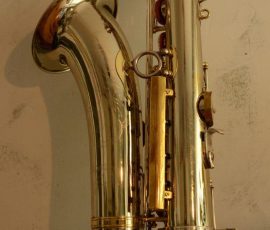 Silver plated with brass posts, ribs, and accents. Source: universalsax on eBay.de