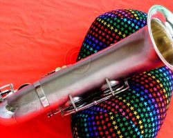 Olds Super tenor #108x silver saxophone against red background, Olds Super tenor sax, vintage American saxophone, rare saxophone, collectible saxophone,