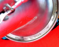 Olds Super tenor #108x silver saxophone against red background, Olds Super tenor sax, vintage American saxophone, rare saxophone, collectible saxophone,