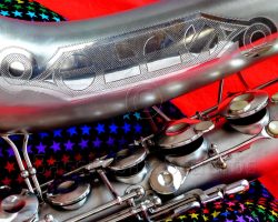 Olds Super tenor #108x silver saxophone against red background, Olds Super tenor sax, vintage American saxophone, rare saxophone, collectible saxophone,