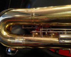 Rene Dumont low Bb bari # 15xxx. Source: Family Movie Warehouse on eBay.com vintage German saxophone, Dörfler & Jörka low Bb baritone sax, stencil sax, Rene Dumont, bow left side, two-tone horn