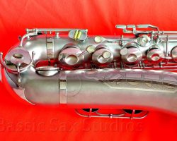 Olds Super tenor #108x silver saxophone against red background, Olds Super tenor sax, vintage American saxophone, rare saxophone, collectible saxophone,