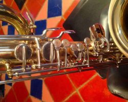 Rene Dumont low Bb bari # 15xxx. Source: Family Movie Warehouse on eBay.com vintage German saxophone, Dörfler & Jörka low Bb baritone sax, stencil sax, Rene Dumont, left hand keys, two-tone horn