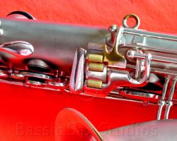 Olds Super tenor #108x silver saxophone against red background, Olds Super tenor sax, vintage American saxophone, rare saxophone, collectible saxophone,