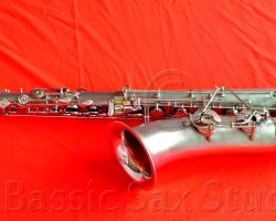 Olds Super tenor #108x silver saxophone against red background, Olds Super tenor sax, vintage American saxophone, rare saxophone, collectible saxophone,