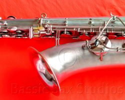Olds Super tenor #108x silver saxophone against red background, Olds Super tenor sax, vintage American saxophone, rare saxophone, collectible saxophone,
