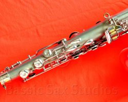 Olds Super tenor #108x silver saxophone against red background, Olds Super tenor sax, vintage American saxophone, rare saxophone, collectible saxophone,