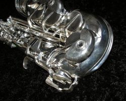 Bell key bumpers & adjustments screws on Toneking alto # 45366. Source: Gerhard Keilwerth. vintage German alto saxophone, Julius Keilwerth, Toneking, saxophone keys, conventional key guards with adjustment screws, silver plated horn on black background