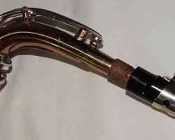 Martelle alto # 55001. Keilwerth stencil of its Toneking. Source: daketasa on eBay.com vintage German alto saxophone, Julius Keilwerth, Toneking, stencil sax with name Martelle on bell, conventional neck fastening screw, two-tone horn against white background, original mouthpiece and ligature attached upside down