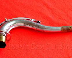 Olds Super tenor #108x silver saxophone against red background, Olds Super tenor sax, vintage American saxophone, rare saxophone, collectible saxophone,