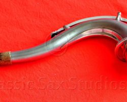 Olds Super tenor #108x silver saxophone against red background, Olds Super tenor sax, vintage American saxophone, rare saxophone, collectible saxophone,