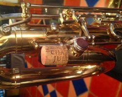 Rene Dumont low Bb bari # 15xxx. Source: Family Movie Warehouse on eBay.com vintage German saxophone, Dörfler & Jörka low Bb baritone sax, stencil sax, Rene Dumont, pigtail, round thumb screw to fasten the neck, two-tone horn