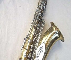 Paragon tenor # 763x D&J copy of The New King. Source: allinwrist on eBay.com vintage German tenor saxophone, Dörfler & Jörka, Paragon, stencil sax, metal angel wing key guard, lacquer sax with nickel plated angel wing, right side of sax with neck attached photographed on white background
