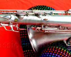 Olds Super tenor #108x silver saxophone against red background, Olds Super tenor sax, vintage American saxophone, rare saxophone, collectible saxophone,