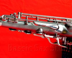 Olds Super tenor #108x silver saxophone against red background, Olds Super tenor sax, vintage American saxophone, rare saxophone, collectible saxophone,