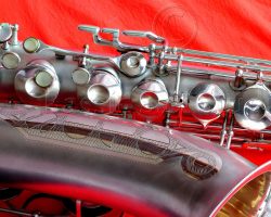 Olds Super tenor #108x silver saxophone against red background, Olds Super tenor sax, vintage American saxophone, rare saxophone, collectible saxophone,