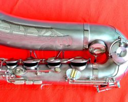 Olds Super tenor #108x silver saxophone against red background, Olds Super tenor sax, vintage American saxophone, rare saxophone, collectible saxophone,