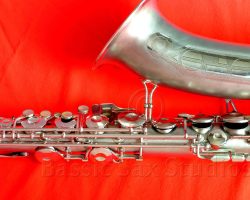 Olds Super tenor #108x silver saxophone against red background, Olds Super tenor sax, vintage American saxophone, rare saxophone, collectible saxophone,