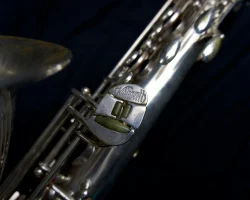 Toneking tenor #28034. Source: Andrew's Gear Outlet on reverb.com vintage German saxophone, Julius Keilwerth, Toneking, left pinkie cluster, silver plated horn on black background