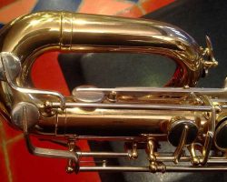 Rene Dumont low Bb bari # 15xxx. Source: Family Movie Warehouse on eBay.com vintage German saxophone, Dörfler & Jörka low Bb baritone sax, stencil sax, Rene Dumont, upper bow, two-tone horn