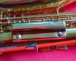 Toneking alto #286XX. Source: Bassic Sax vintage German saxophone, Julius Keilwerth, Toneking, replacement metal clothes guard, lacquer horn on red background