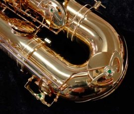 Source: saxquest.com bass saxophone, P. Mauriat, PM-350, gold lacquer bass sax, short wrap bass saxophone, French wrap, bow right side