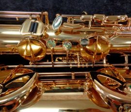 Source: saxquest.com bass saxophone, P. Mauriat, PM-350, gold lacquer bass sax, short wrap bass saxophone, French wrap, right hand keys