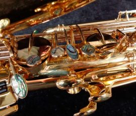 Source: saxquest.com bass saxophone, P. Mauriat, PM-350, gold lacquer bass sax, short wrap bass saxophone, French wrap, left hand keys