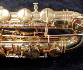 Source: saxquest.com bass saxophone, P. Mauriat, PM-350, gold lacquer bass sax, short wrap bass saxophone, French wrap, upper bow
