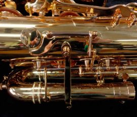 Source: saxquest.com bass saxophone, P. Mauriat, PM-350, gold lacquer bass sax, short wrap bass saxophone, French wrap, octave lever
