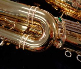 Source: saxquest.com bass saxophone, P. Mauriat, PM-350, gold lacquer bass sax, short wrap bass saxophone, French wrap, spit value