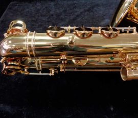 Source: saxquest.com bass saxophone, P. Mauriat, PM-350, gold lacquer bass sax, short wrap bass saxophone, French wrap, socket