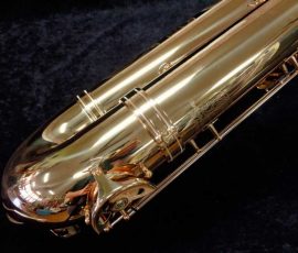 Source: saxquest.com bass saxophone, P. Mauriat, PM-350, gold lacquer bass sax, short wrap bass saxophone, French wrap, company logo, serial number