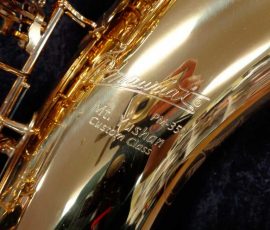 Source: saxquest.com bass saxophone, P. Mauriat, PM-350, gold lacquer bass sax, short wrap bass saxophone, French wrap, company & model stamping on bell