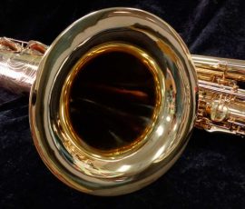 Source: saxquest.com bass saxophone, P. Mauriat, PM-350, gold lacquer bass sax, short wrap bass saxophone, French wrap, bass sax bell