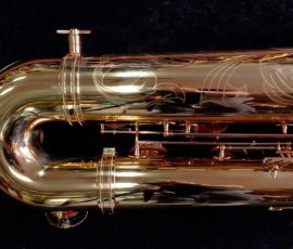 Source: saxquest.com bass saxophone, P. Mauriat, PM-350, gold lacquer bass sax, short wrap bass saxophone, French wrap