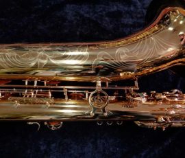 Source: saxquest.com bass saxophone, P. Mauriat, PM-350, gold lacquer bass sax, short wrap bass saxophone, French wrap
