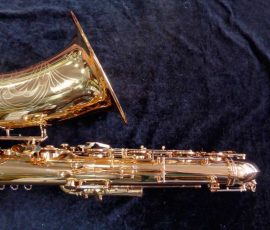 Source: saxquest.com bass saxophone, P. Mauriat, PM-350, gold lacquer bass sax, short wrap bass saxophone, French wrap