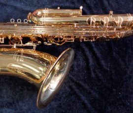 Source: saxquest.com bass saxophone, P. Mauriat, PM-350, gold lacquer bass sax, short wrap bass saxophone, French wrap