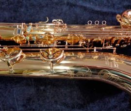 Source: saxquest.com bass saxophone, P. Mauriat, PM-350, gold lacquer bass sax, short wrap bass saxophone, French wrap