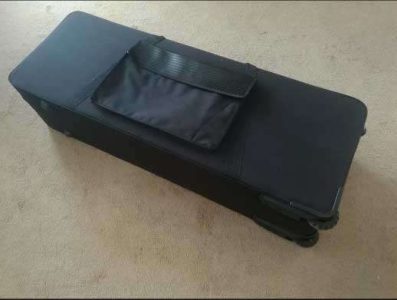 Source: canex-group.en.made-in-china.com bass saxophone case with wheel, black fabric cover, outside pocket for music, case for Jinbao-made Selmer Super Action 80 Series II copy bass saxophones, short wrap bass saxophones