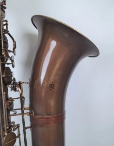 Source: emmusicstore on eBay.com Eastern Music bass saxophone, Jinbao-made bass saxophone, short wrap bass, stencil sax, Chinese bass sax, Super Action 80 Series II copy, vintage patina finish, bell stamping with logo