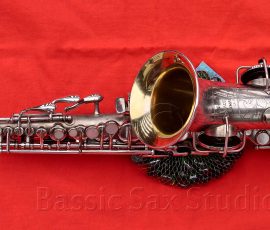 Pan American 62M Bb curved soprano # 43xxx. Not quite an antique, but nearly. ;) silver plated saxophone on red background, vintage curved soprano, Pan American 62M curved soprano, silver sax with gold wash inner bell,