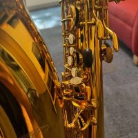 Serial # unknown. Source: rusbra_0 on eBay.com low A bari sax, Dave Guardala Artist Series baritone saxophone, floral engraving, lacquer saxophone