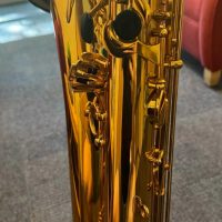 Serial # unknown. Source: rusbra_0 on eBay.com low A bari sax, Dave Guardala Artist Series baritone saxophone, floral engraving, lacquer saxophone