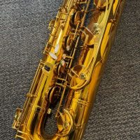 Serial # unknown. Source: rusbra_0 on eBay.com low A bari sax, Dave Guardala Artist Series baritone saxophone, floral engraving, lacquer saxophone