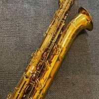 Serial # unknown. Source: rusbra_0 on eBay.com low A bari sax, Dave Guardala Artist Series baritone saxophone, floral engraving, lacquer saxophone