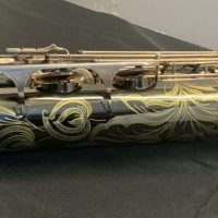 Serial # 013266. Source: Cliff's Gear Outlet on reverb.com low A bari sax, Dave Guardala Artist Series baritone saxophone, floral engraving, black nickel plated with silver plated keys, B&S