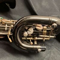 Serial # 013266. Source: Cliff's Gear Outlet on reverb.com low A bari sax, Dave Guardala Artist Series baritone saxophone, floral engraving, black nickel plated with silver plated keys, B&S