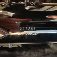 Serial # 013266. Source: Cliff's Gear Outlet on reverb.com low A bari sax, Dave Guardala Artist Series baritone saxophone, floral engraving, black nickel plated with silver plated keys, B&S